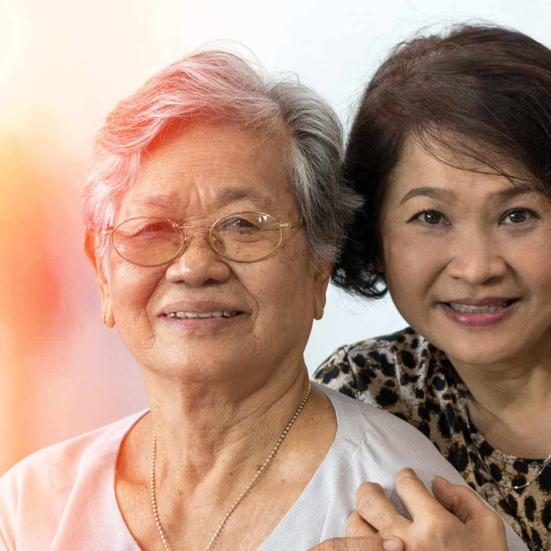 Happy Asia senior mother and adult daughter concept. Portrait of Asian family older ageing women and caregiver smiling with happiness at home, or wellbeing county  hospice.
